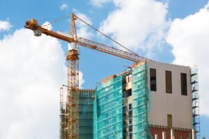 construction-crane-and-building-against-a-blue-sky